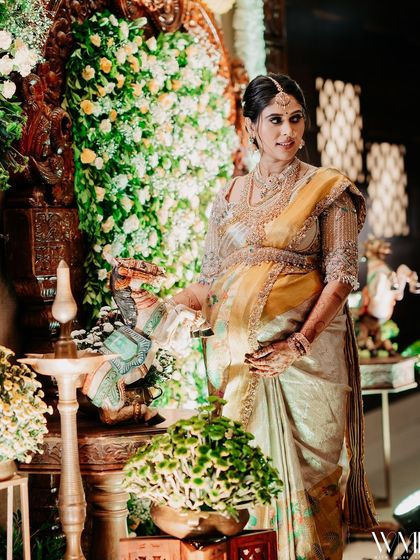 A shot of me standing by a Ganesha idol, the traditional setting adding to the auspiciousness of the occasion.