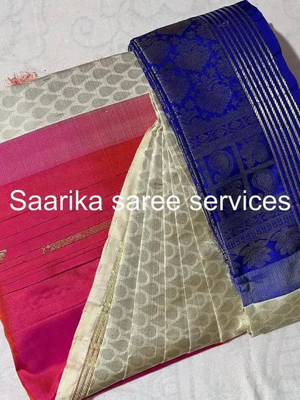 A collection of three sarees in pink, white, and blue, showing a variety of styles.