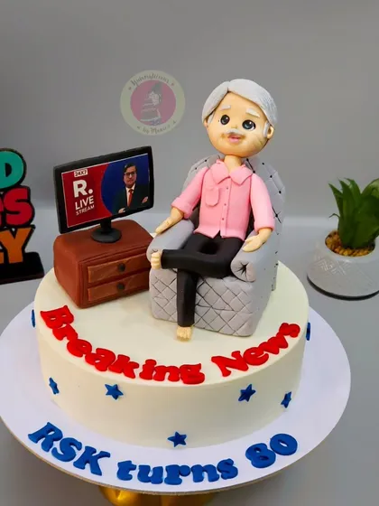 The full view of the "Breaking News" cake for an 80th birthday, celebrating a dad who loves staying updated with current events.