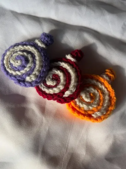 A different angle of my three cake roll charms. They look so yummy, like tiny little desserts for your bag.