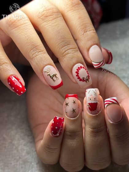 Another angle of our Christmas magic set, showing the different hand-painted designs on each nail.