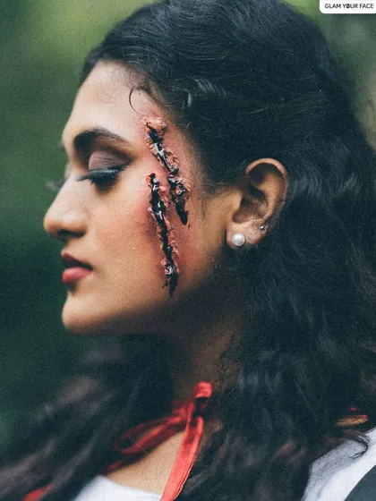 Special effects makeup is all about creating believable illusions. For this "Little Red Riding Hood" themed shoot, I created a realistic scar effect to add a dark, narrative element to the character's story.