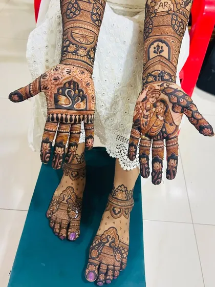 A complete bridal mehendi set, showing how I coordinate designs across both hands and feet. This set includes intricate patterns, traditional motifs like swans, and a divine Radha Krishna portrait, telling a complete story for the bride's big day.