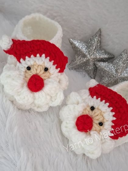 Another view of the cute Santa booties, perfect for baby's first Christmas or a holiday-themed photoshoot.