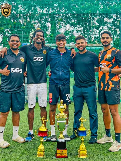 Our coaching staff with the spoils of victory. A proud moment showcasing the numerous trophies won at the Bombay Super Championship.