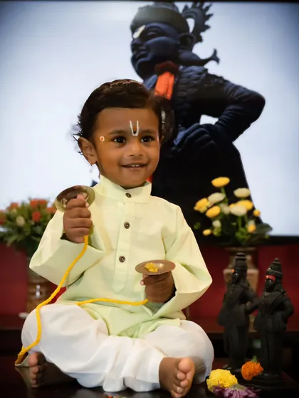 Capturing pure, unfiltered joy is my specialty. This little one, dressed as a 'Chota Varkari' for an Ashadi Ekadashi themed shoot, has a smile that lights up the frame. I love creating these unique, festive memories for families.