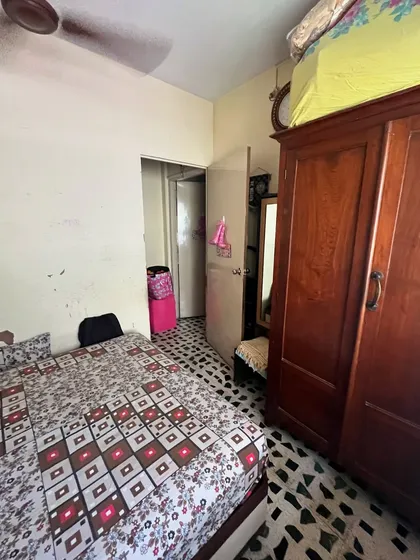 Another 'before' view of the Vora House kids' room, showing the old wardrobe and awkward layout. My goal was to completely reimagine this space for two young girls.