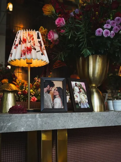 We love dotting the venue with the couple's favorite photos. It makes the space feel more personal and shares their journey with all their guests.
