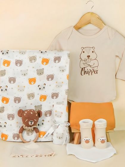 A 'Chipper' themed baby boy clothing set. The items are laid out clearly, showing the complete outfit and coordinating blanket.