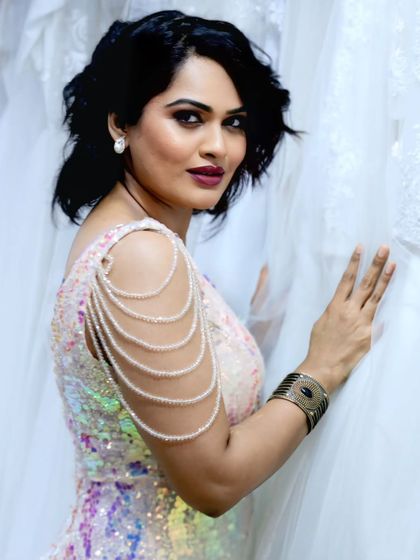 A close-up of this iridescent sequin gown. The draped pearl shoulder detail is one of my signature touches, adding a soft, feminine contrast to the dazzling sequins.