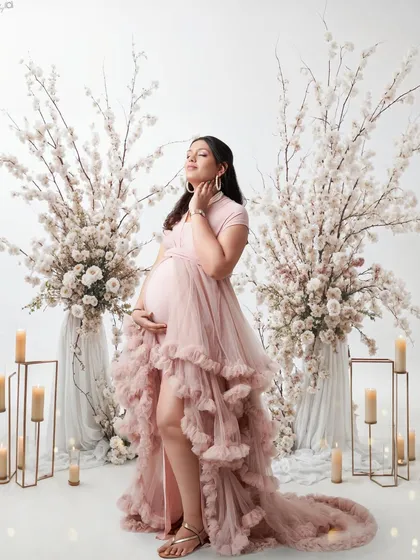 This is for the mom who wants a truly dreamy and elegant maternity session. We created a fairytale setting with flowing gowns, soft candlelight, and beautiful floral arrangements to celebrate her journey to motherhood.