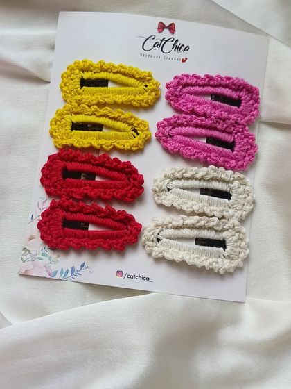 A set of four pairs of our crochet barrettes in yellow, pink, red, and cream. A great starter set to match many different outfits.