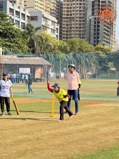 A woman in mid-delivery action during a PPL match, demonstrating the enthusiasm and skill on display in our women's cricket games.