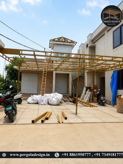 This image captures the scale of a large, multi-car carport during the construction phase. The extensive steel framework is engineered to provide maximum coverage with minimal pillars, ensuring an open and easily accessible parking area.