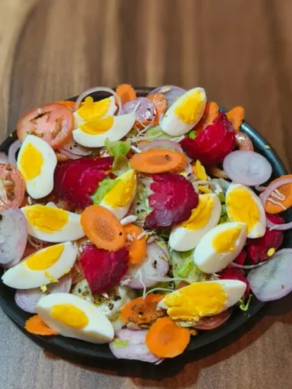 For a healthy option, try my fresh egg salad. It's loaded with boiled eggs, beetroot, carrots, onions, and tomatoes, making it a nutritious meal.
