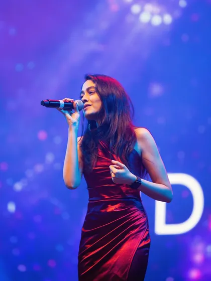 This is me in my element, lost in the music on stage. I love connecting with the audience and creating a vibe, whether it's for a huge concert or a private wedding performance.