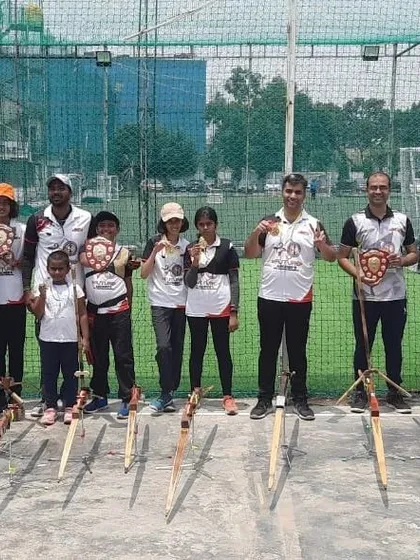 Our team posing with their bows after a successful inter-academy competition. This photo captures the pride and togetherness we feel, whether we win or lose.