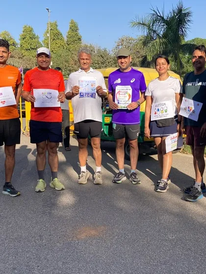 A group of our runners proudly wearing their bibs for the cause. Every step we take together makes a difference.