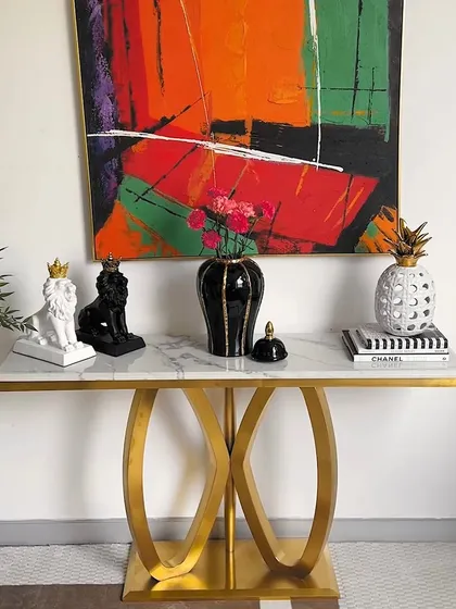 A third look for our versatile console table. The combination of the timeless furniture piece with vibrant, modern art and decor shows how you can make our designs uniquely your own.