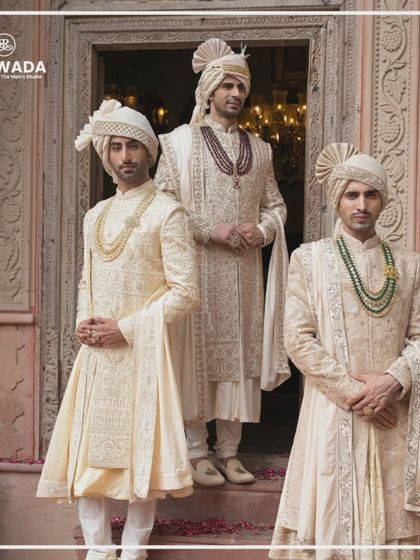 This image captures the regal presence of the Shauhar groom. The intricate embroidery and luxurious fabric of the sherwanis are designed to make a statement of timeless elegance.