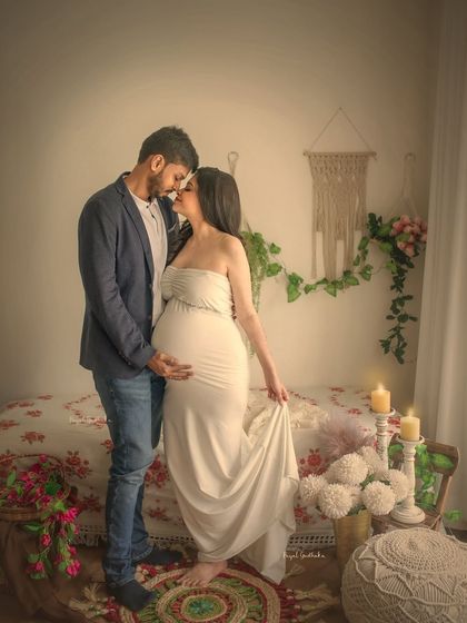 A romantic and intimate portrait of the couple in the bohemian studio. The soft lighting and cozy setup create the perfect atmosphere for capturing their deep connection.