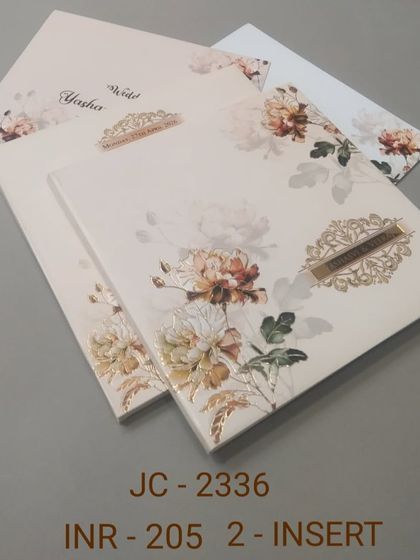 A simple yet beautiful invitation with a large floral print in warm, autumnal tones. The design is modern and artistic, ideal for a contemporary wedding.