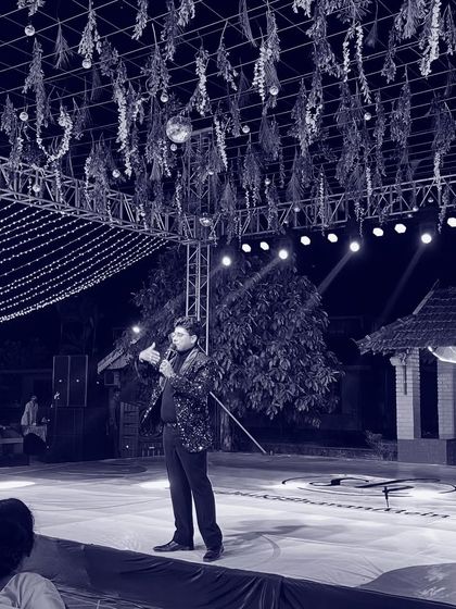 A quiet moment on stage before the festivities begin. The lights, the setup, the anticipation. This is my space, where I prepare to create an evening of memories for you.