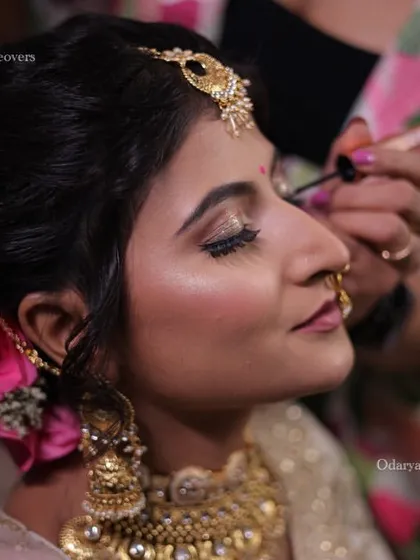 A behind the scenes shot of me adding the final touches. I pay close attention to every detail, like defining the eyeliner, to ensure a perfect and long lasting bridal look.