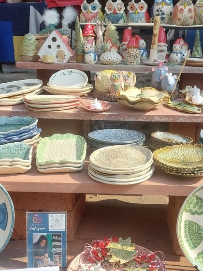 Another view of my stall at the Bhopal Potter's Market. I love arranging my pieces, creating a landscape of colorful plates, bowls, and figurines.