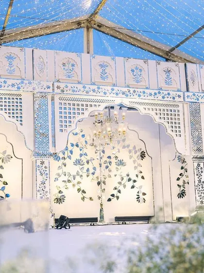 A closer look at the hand-cut Thikri mirror mosaic backdrop. This traditional craft, brought to Bangalore by artisans from North India, reflects light beautifully, creating a shimmering, dynamic surface that elevates the entire event space.
