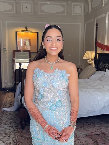 The happy client, her sweet and playful hairstyle adding to her youthful charm.