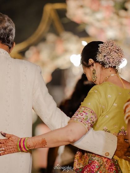 A simple, powerful shot of the parents of the bride, supporting each other after the Vidaai.
