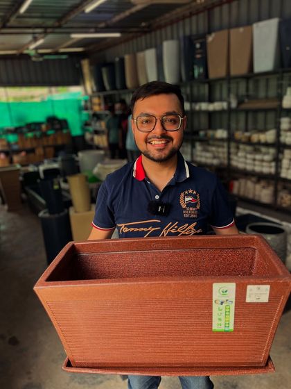 A close-up of the textured finish on one of my brown roto 'kishti' planters, a durable and stylish choice for any home.