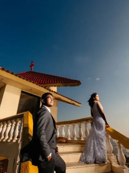 A post-wedding shoot with a beautiful coastal view. The low angle and wide expanse of the sky create a sense of freedom and possibility, perfectly capturing the beginning of a new chapter.