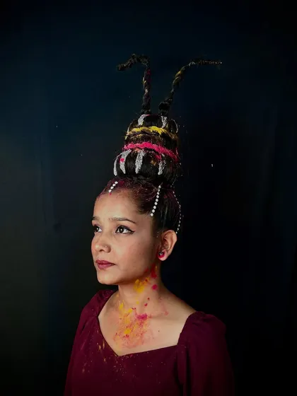 Another example of avant-garde hairstyling and makeup, showing the limitless creativity our students are encouraged to explore.