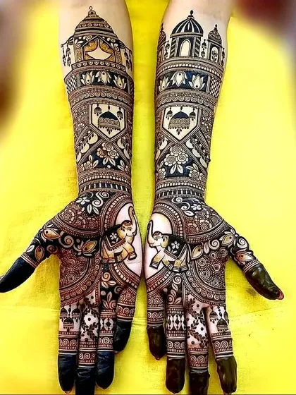 This regal design features majestic elephants on the palms, with detailed architectural domes on the wrists. The dark, rich application makes the motifs pop.