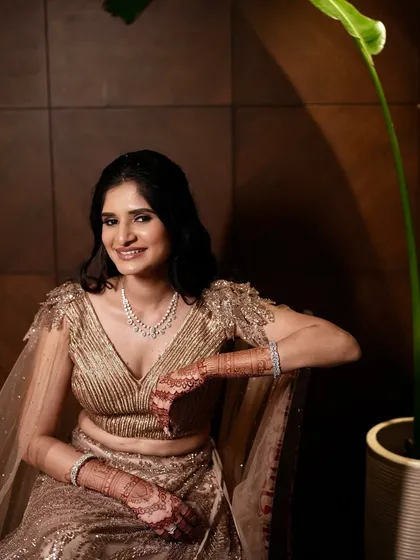 A vision of grace for an engagement ceremony. This soft look with a golden glow and subtle makeup is all about timeless charm and celebrating the start of a beautiful forever.