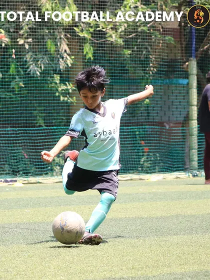 A powerful shot from one of our U7 players during the match against Raheja FC.