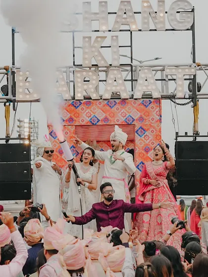 Another epic shot with the CO2 cannon blasting as the couple and their family celebrate on the moving stage. These are the moments that make a wedding unforgettable.