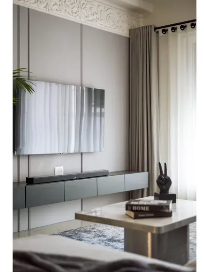 A full view of the TV wall and center table. The entire ensemble is a perfect balance of modern design and classic elegance.