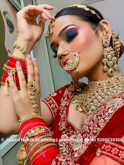 A bride with vibrant, multi-colored eye makeup, showing a modern and artistic take on bridal beauty. Our courses encourage creativity and experimentation.