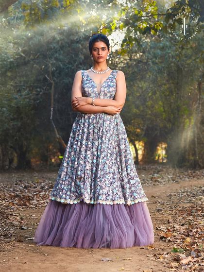 A full-length shot showing the layered tulle beneath the floral embroidery. This gown has beautiful movement and a dreamy quality.