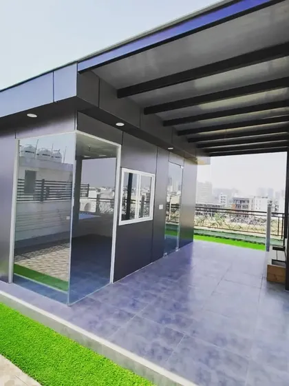 The terrace room and its attached pergola create a large, covered outdoor living area, perfect for any weather.