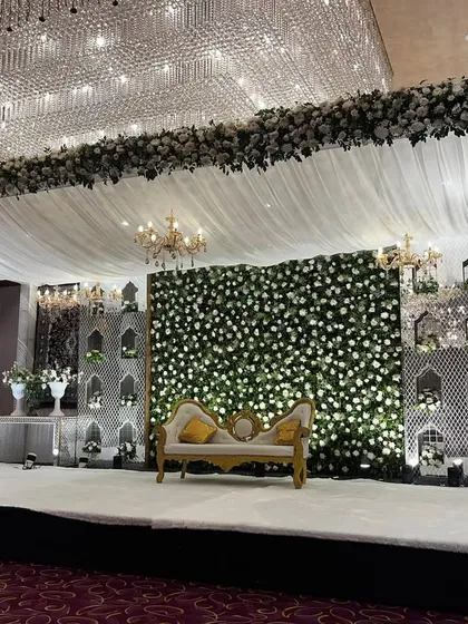 A side view of the grand Walima stage, highlighting the depth and layers of the decor.