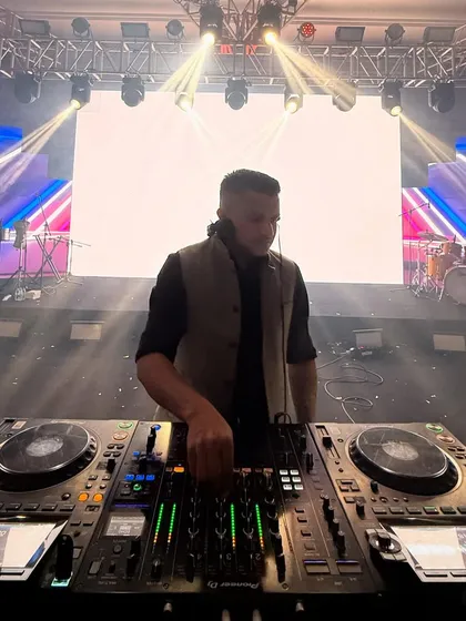 Mixing tracks on my Pioneer DJ setup. Having professional-grade equipment is essential to deliver a seamless and high-quality audio experience for every event.