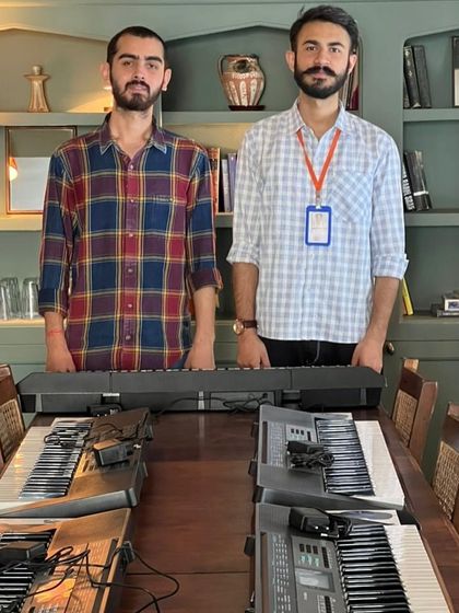 Two of our dedicated mentors ready to kick off the keyboard workshop. We're passionate about making music accessible and fun for everyone.