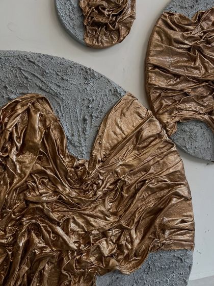 Another detail of the Dubai commission, showing the larger panel where the gold fabric seems to flow across the textured surface.