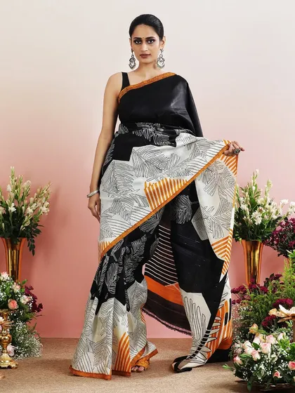 A full view of the black and white leaf print saree, a modern and stylish choice.