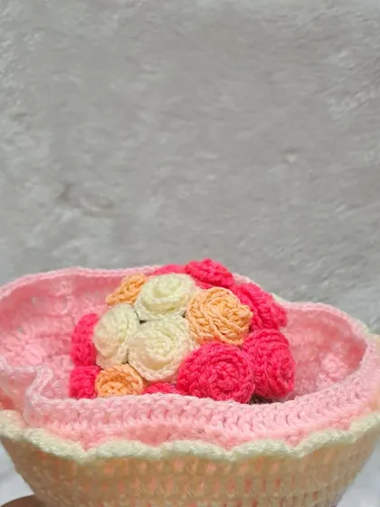 A close-up of the bouquet when the doll is flipped. The mix of cream, orange, and pink roses creates a warm and inviting color palette.