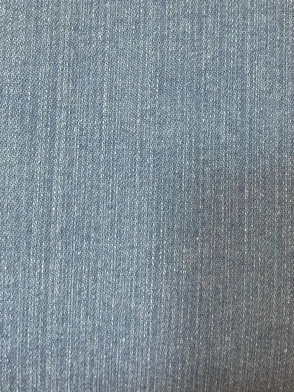 The subtle vertical grain of a light blue denim. This classic fabric is versatile and can be used for a wide range of jean styles and fits.